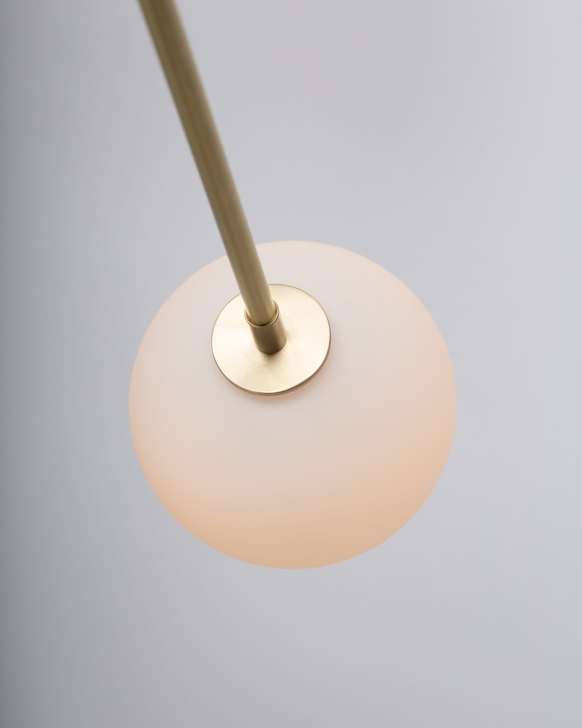 Six Matte Sphere Articulating Satin Brass Pendant