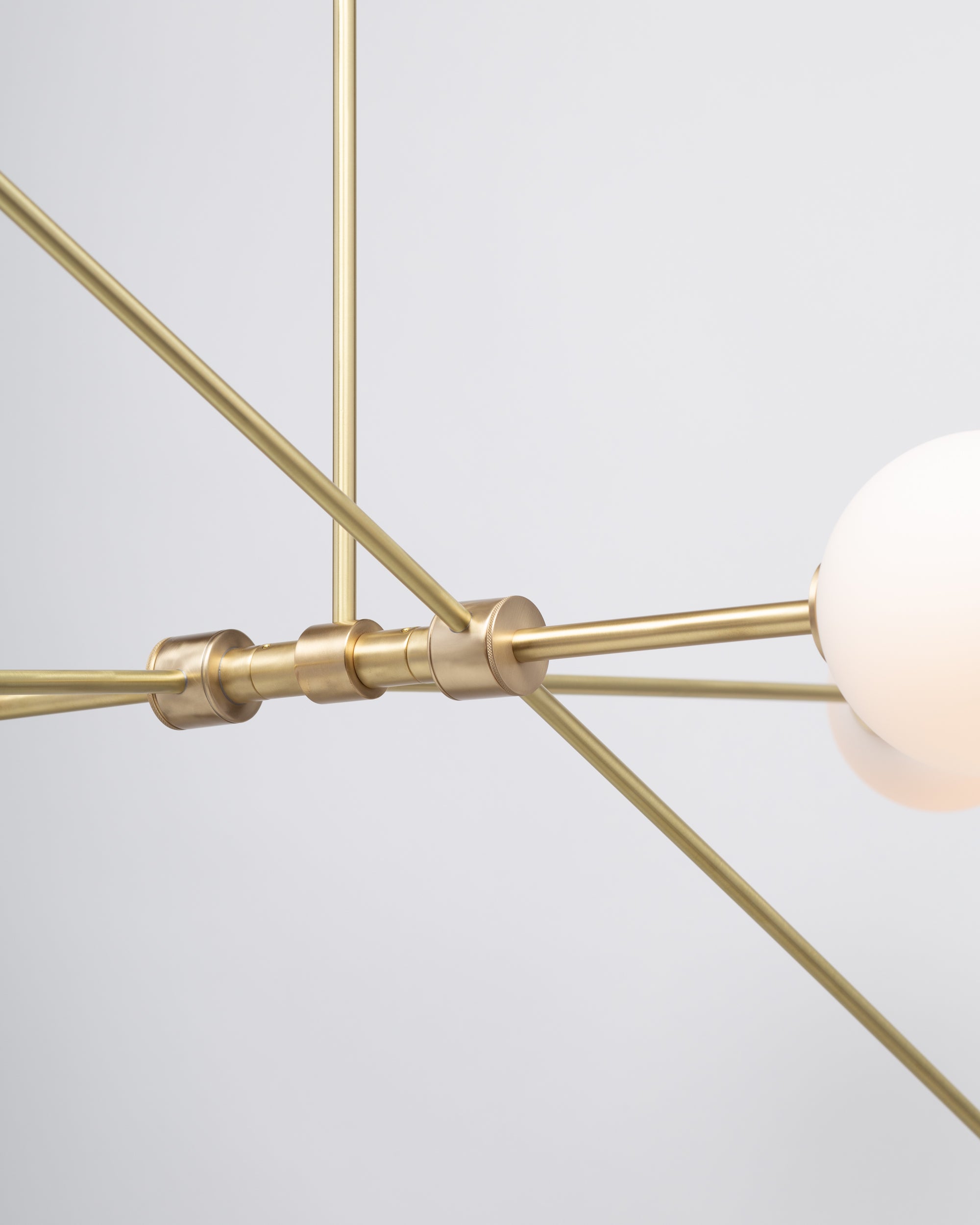 Six Matte Sphere Articulating Satin Brass Pendant