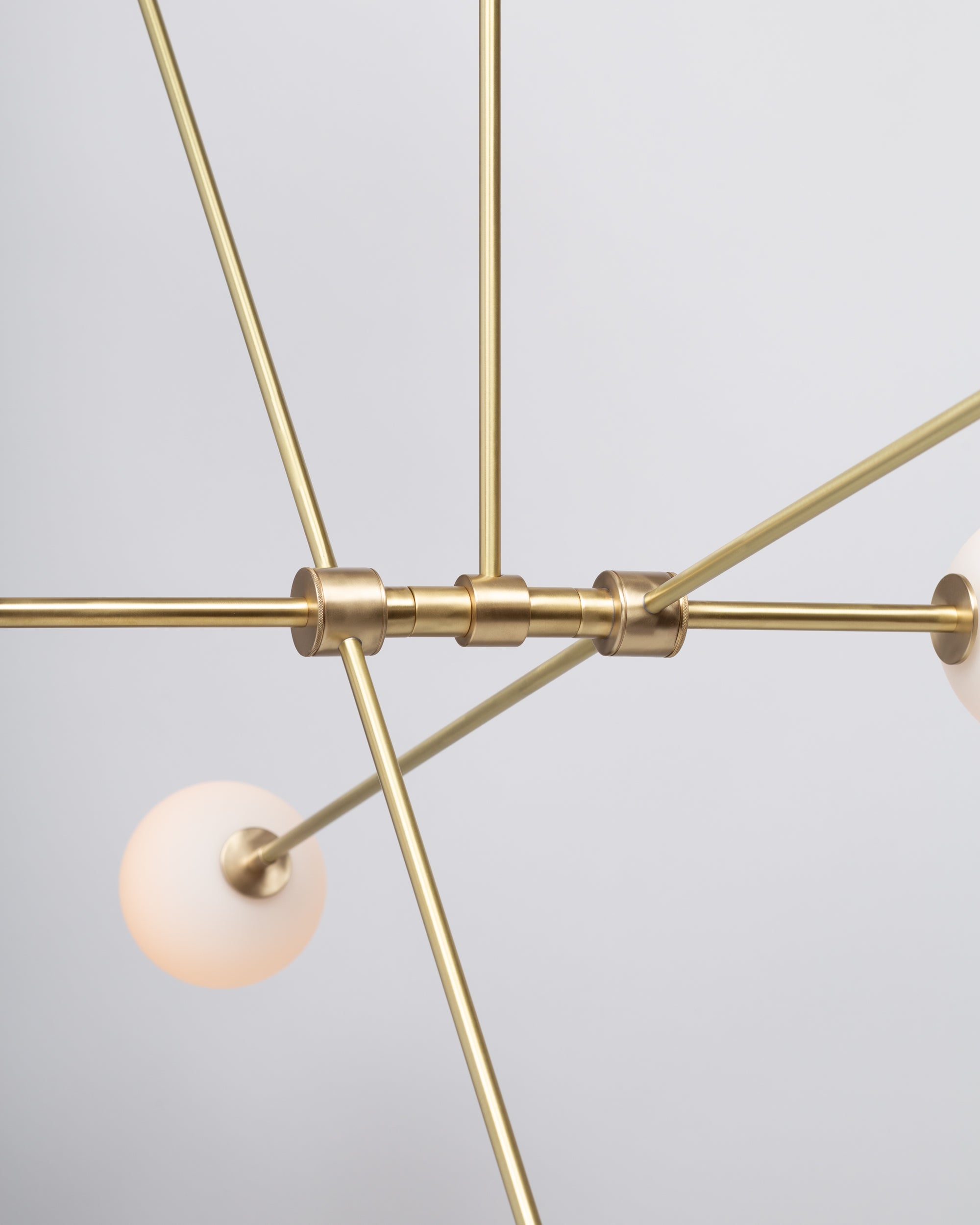 Six Matte Sphere Articulating Satin Brass Pendant